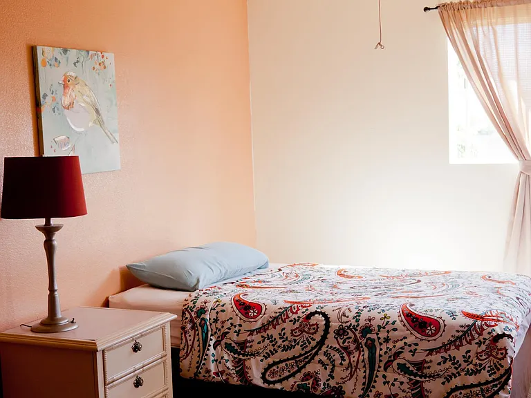 This is an old photo of bedroom. It's been completely remodeled, paint ceiling fan, doors, curtains, doorknobs, closet doors, furniture