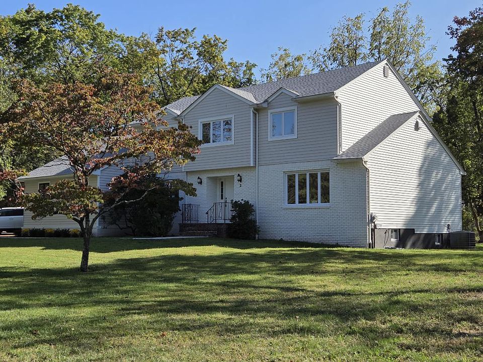 "Front of the home features a stylish pineapple lights, symbolizing hospitality and elegance."