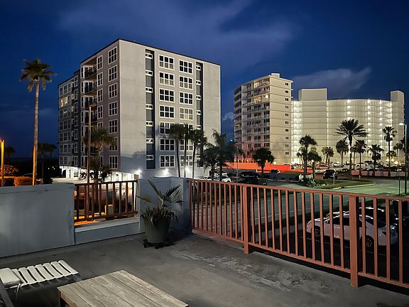 Upstairs deck at night is perfect spot for you to wind down feeling the ocean breeze and hearing the ocean waves.