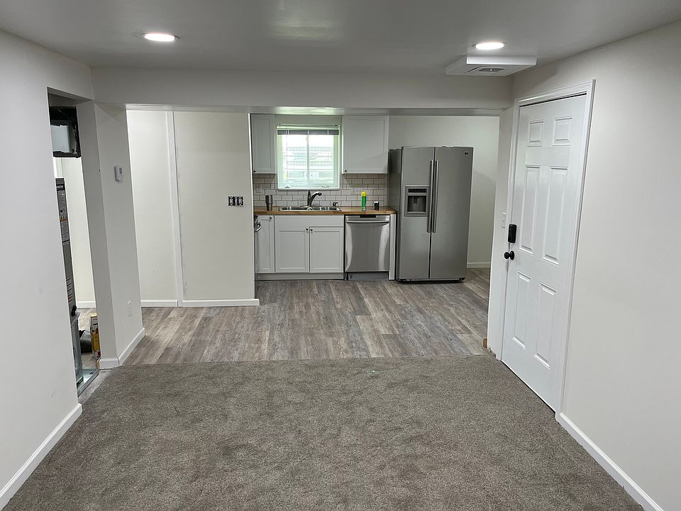 Living Area / Kitchen, Entry Door #1 to the right. Furnace / utility closet to the left for more storage.
