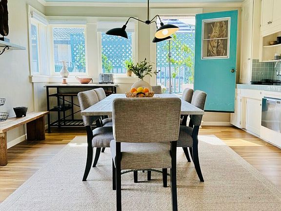 Large Kitchen with Dining Space and Private Balcony access.