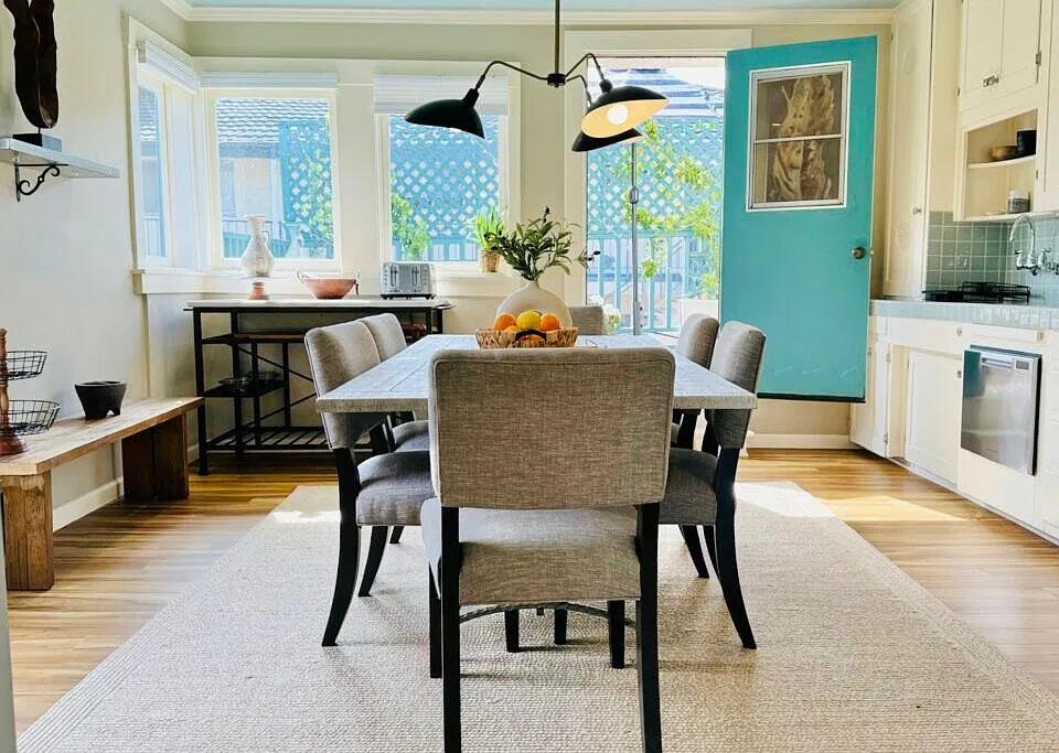 Large Kitchen with Dining Space and Private Balcony access.