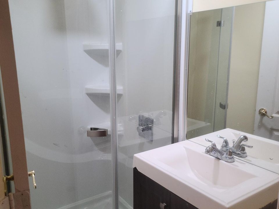 The bathroom has a stand-up shower .