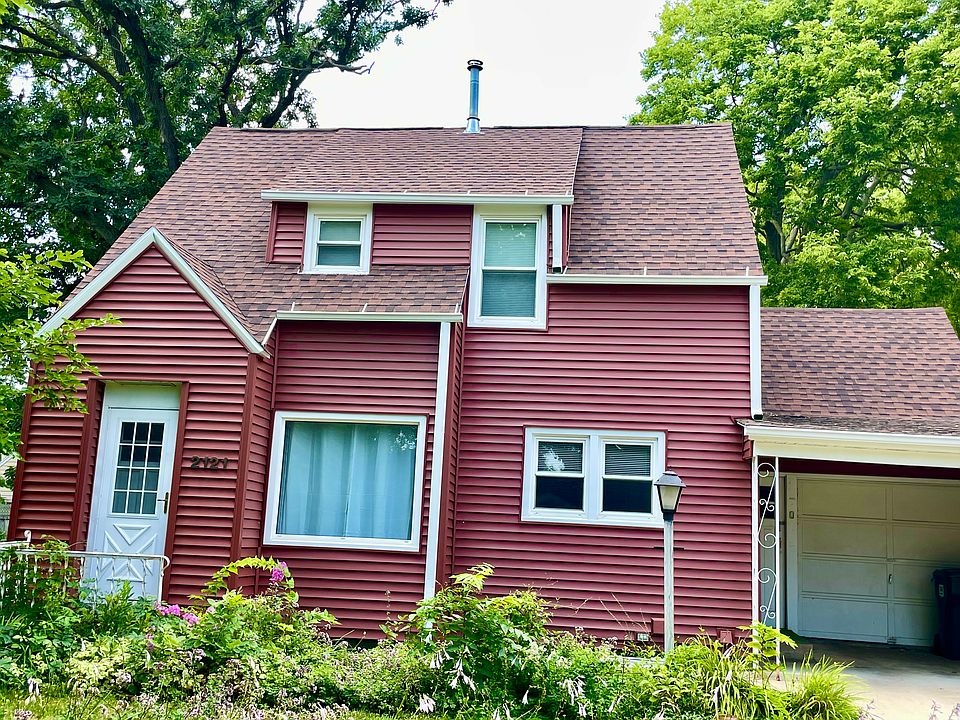 Cute, cottage-style house with carport/one car garage.