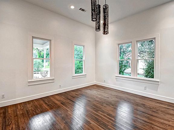 This room is located at the front of the house and could serve as an office space or living area.