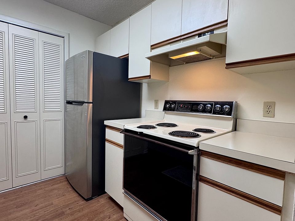 Kitchen w/ pantry and stainless steel fridge