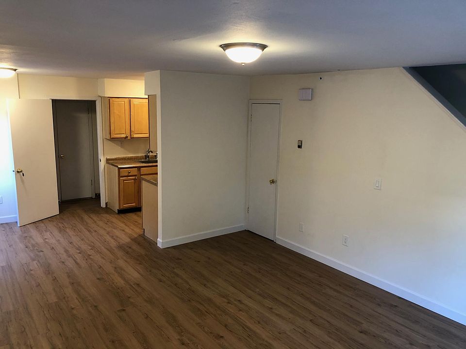 First floor living room, dining and kitchen - stairs up to second level bedrooms.
