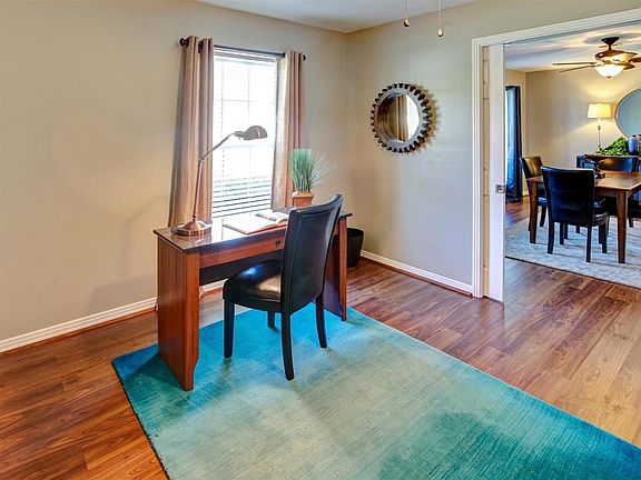This versatile room can be whatever you need: a home office, study/library, formal living room, Note the pocket doors.