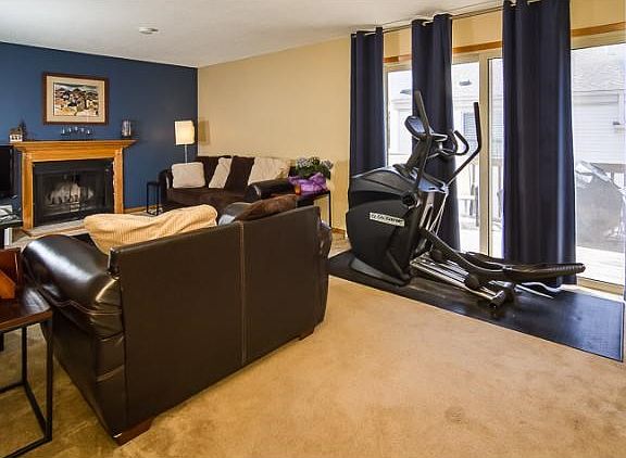 Open bright living room. Gas fireplace and plenty of natural light.
