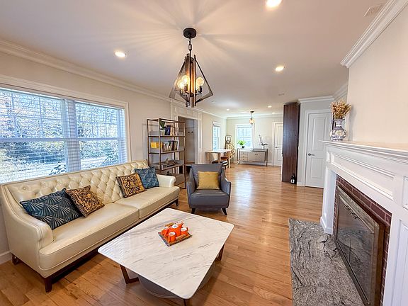 Open concept living area with wood burning fireplace