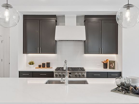 Kitchen with full-height tile backsplash