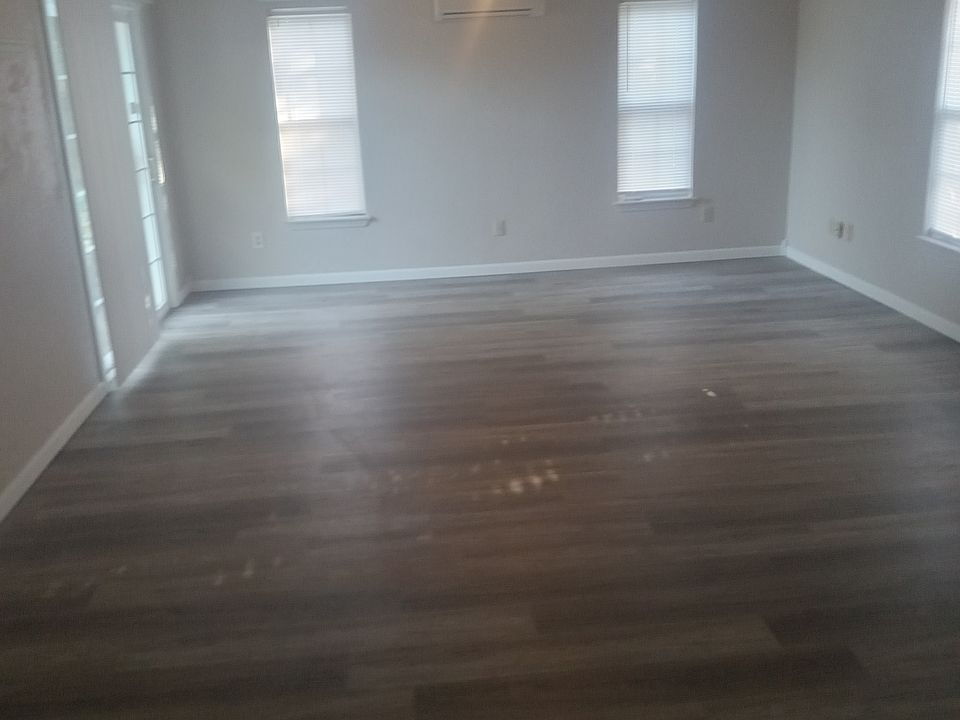 This is a pic of the open family room in which shows the family room is huge and the patio leads into the back yard. More pictures will be loaded very soon. Such as: the other bedrooms and kitchen, and hallway.