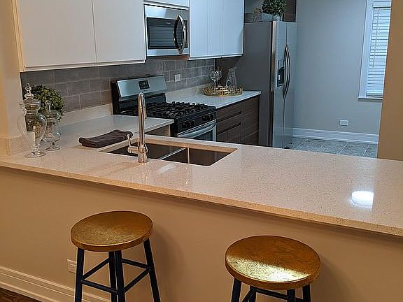 Large stone countertops and brand new kitchen. Plenty of storage and workspace