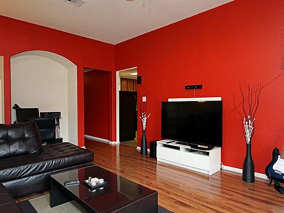 Enter into the living room with an arched nook for your media equipment or desk.