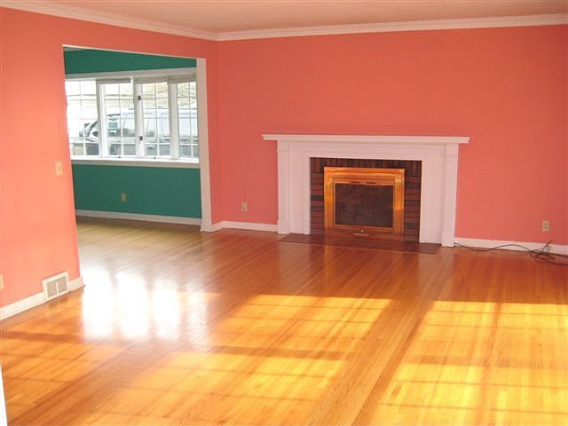 Living room with hardwood floors and fireplace