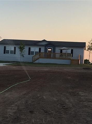 3 Bedrooms, 2 bathrooms, 1456 sqft. Front deck is 10ft by 25ft.Home is set back 180 feet from road.