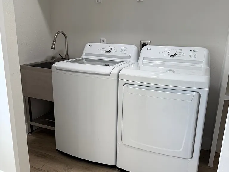 Laundry area with utility sink