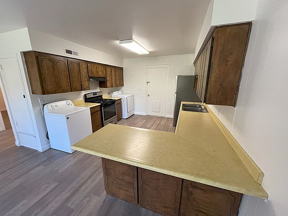 Kitchen area. Generous counter space and major appliances.
