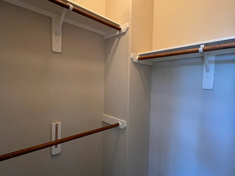 Walk-in closet in primary bathroom