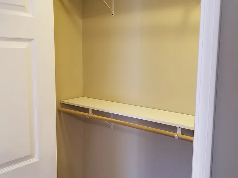 MASTER BEDROOM CLOSET WITH DOUBLE HUNG SHELVES AND RODS