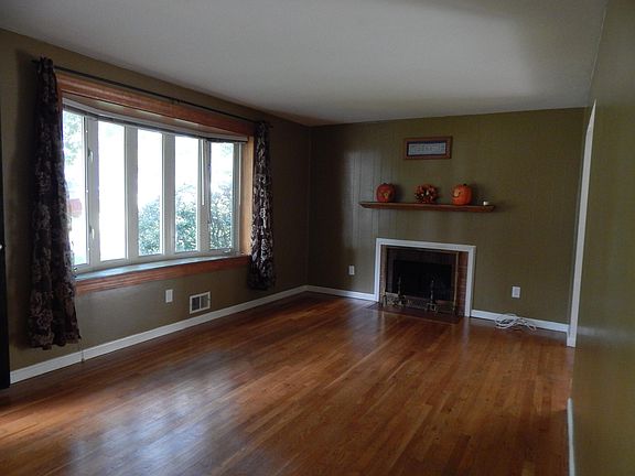 Living Room with large bay window and working fireplace.