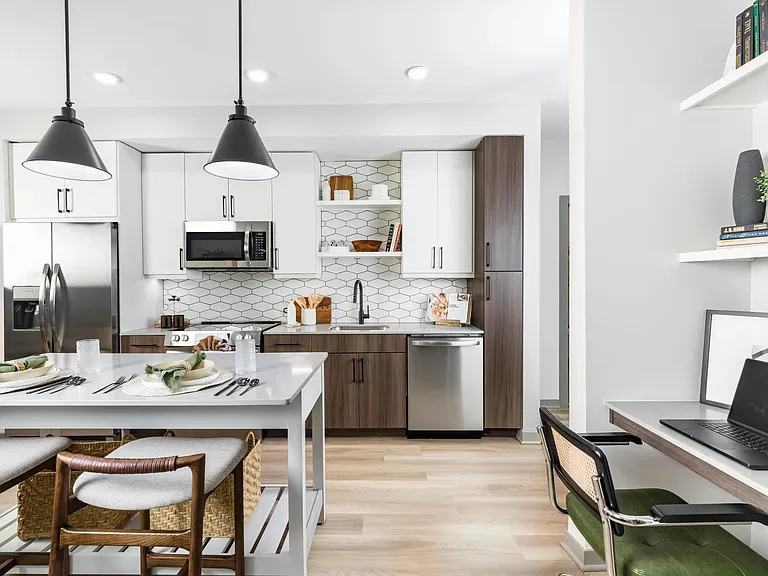 Modern kitchen with two-tone cabinets and workspace nearby_ideal for everything from meal prep to meetings.