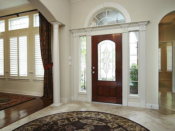 Huge entry way with Travertine tile floor