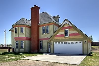 2 car Attached Garage w/lots of storage above.