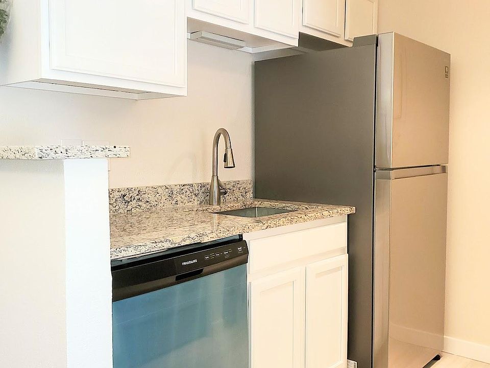 Full sized refrigerator and dishwasher, pull down faucet and great counterspace