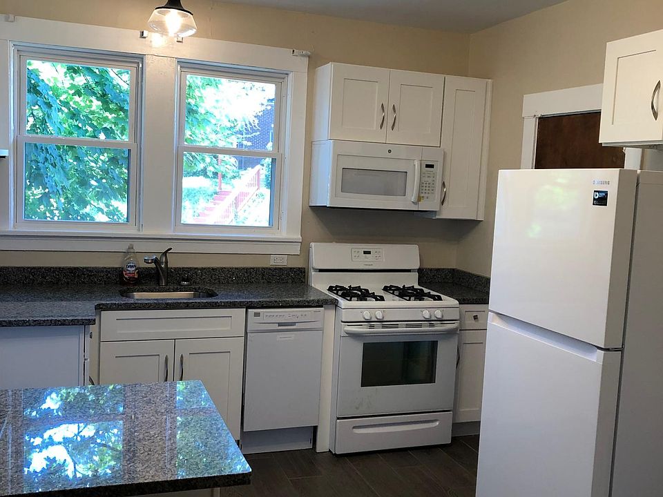 Kitchen 
granite counter top, gas range, microwave, & dishwasher