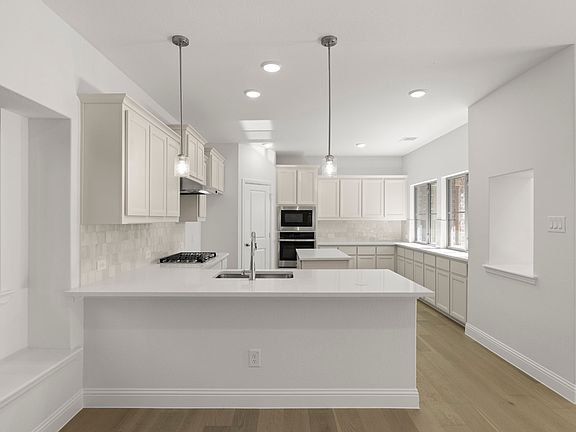 Trentino two-story floor plan featuring 4 bedrooms, 3 bathrooms, a welcoming front porch, formal din