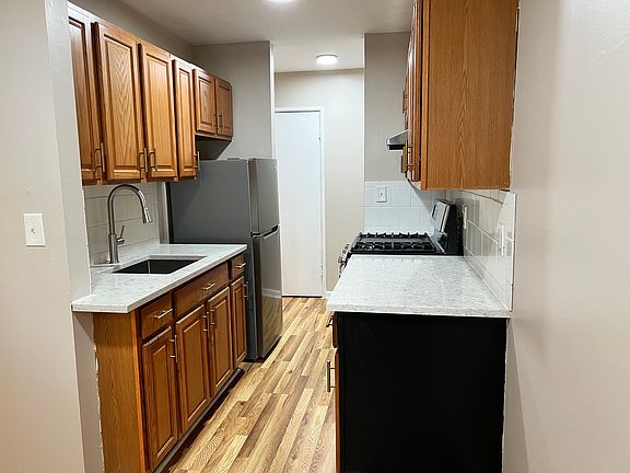 Gleaming quartz countertops and stainless steel appliances