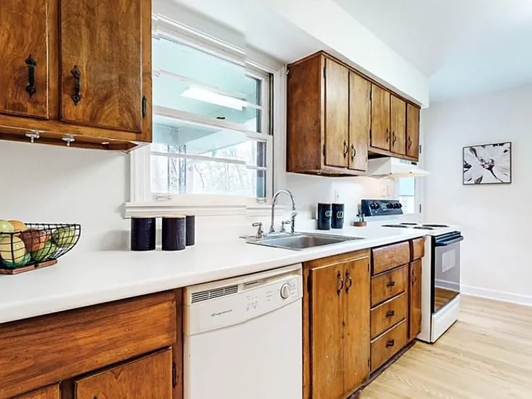 Kitchen - the cabinets, sink, and appliances have updated since this photo.