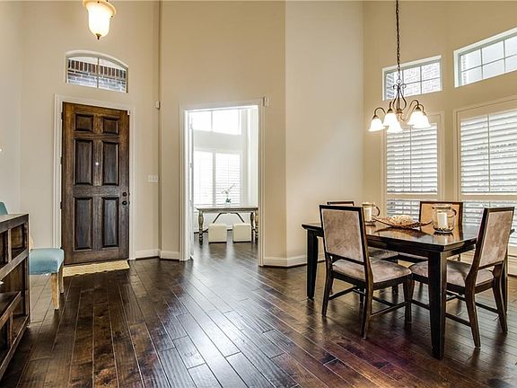 Light and bright foyer with gorgeous wood floors!
