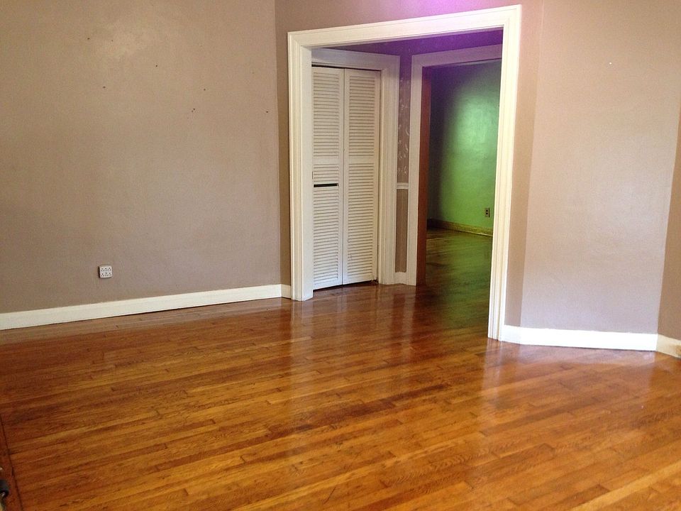 Living room toward dining room and small bedroom