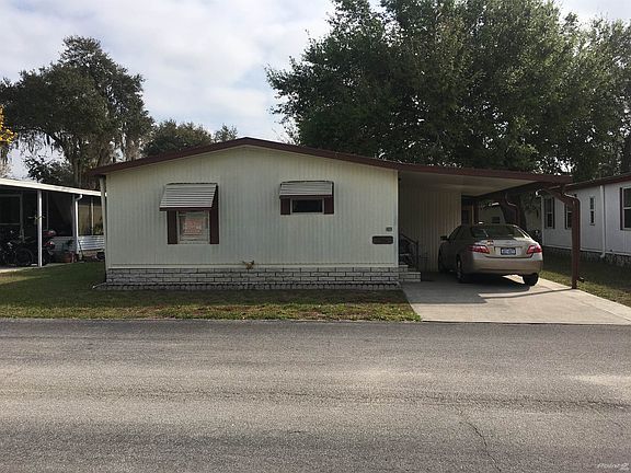 Front of Home w/ Attached Carport