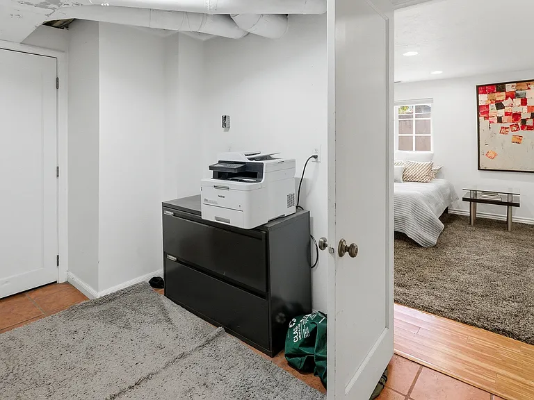 Storage space with laundry on lower level.
