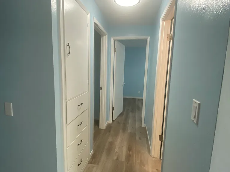Hallway with linen cabinet
