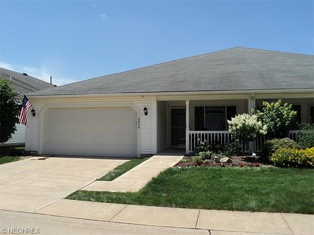 Welcome to 6908 Savannah Drive !  Notice the inviting front porch and attached 2-car garage.