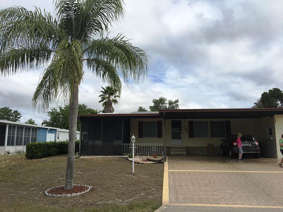 Front of home has two car parking under car port