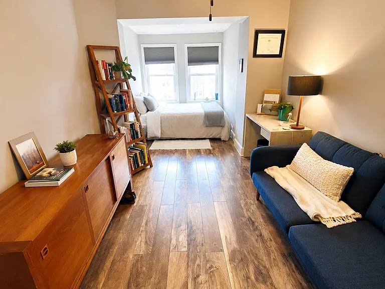 Top floor left bedroom. Offers room for a bed plus a small living room or desk/working area.