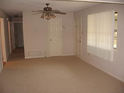 New carpet in living area, hallway, and bedrooms.