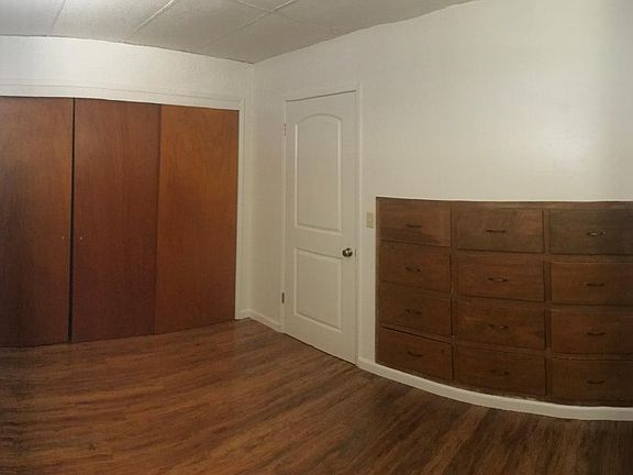 panoramic photo of bedroom three door closet and built in drawers 12 x 9.5