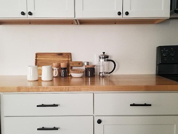 A drip coffee machine, French press, and electric kettle are provided.