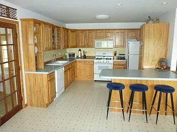 Kitchen with Breakfast Counter & gorgeous hickory cabinetry