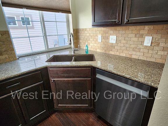 Granite countertops, tile backsplash, stainless steel appliances, tons of cabinet space!