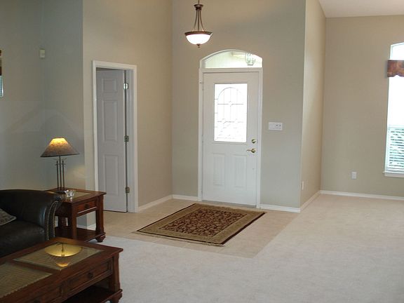 A transom window over the front door illuminates the new ceramic tile entry.