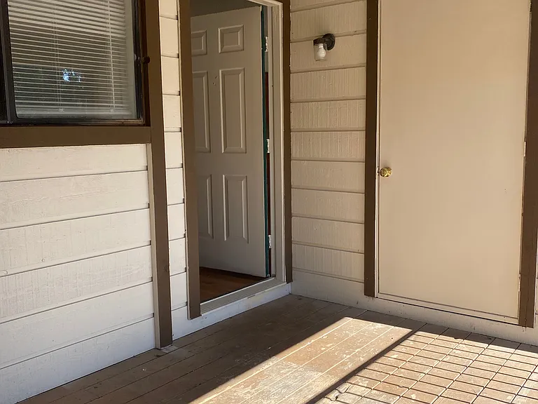 Front Entrance w/ door on the right being your unit's private laundry room closet with included Washer & Dryer.