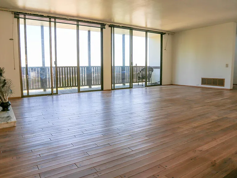 living room with north facing windows and balcony with panoramic view