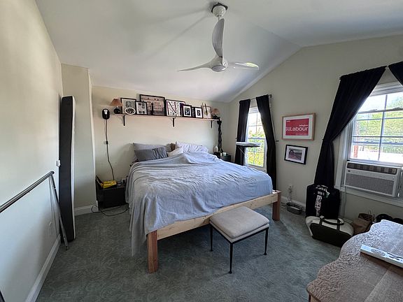 Master bedroom with tall ceilings and large closet